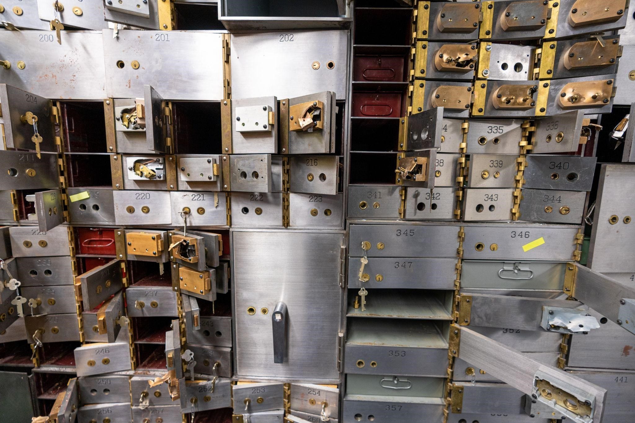 Safe deposit boxes emptied out in a bank vault.