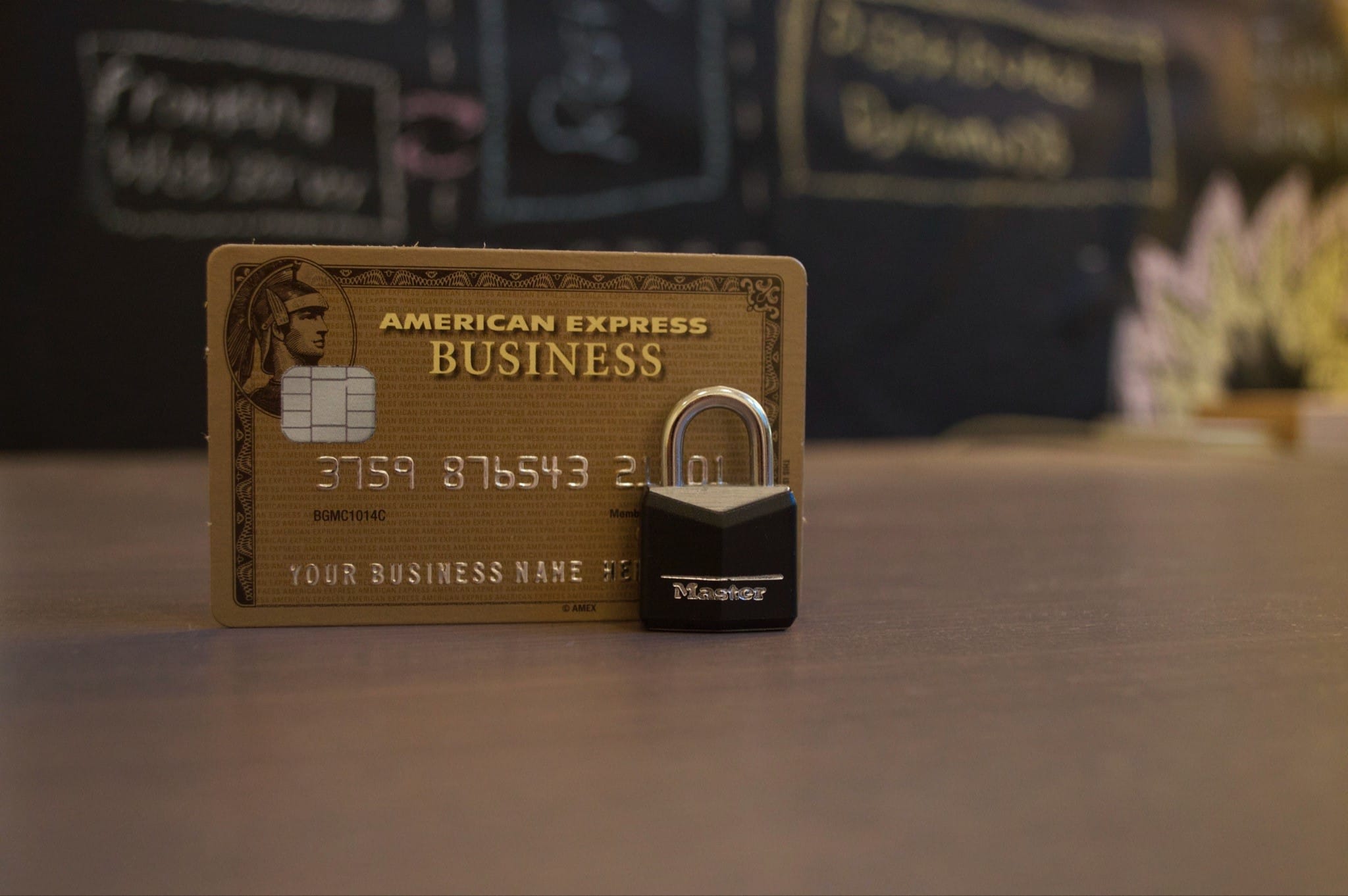 A padlock in front of a credit card.