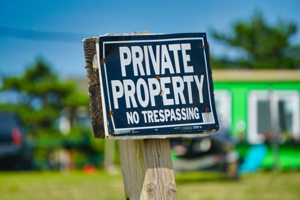 A sign that reads “Private Property No Trespassing”.